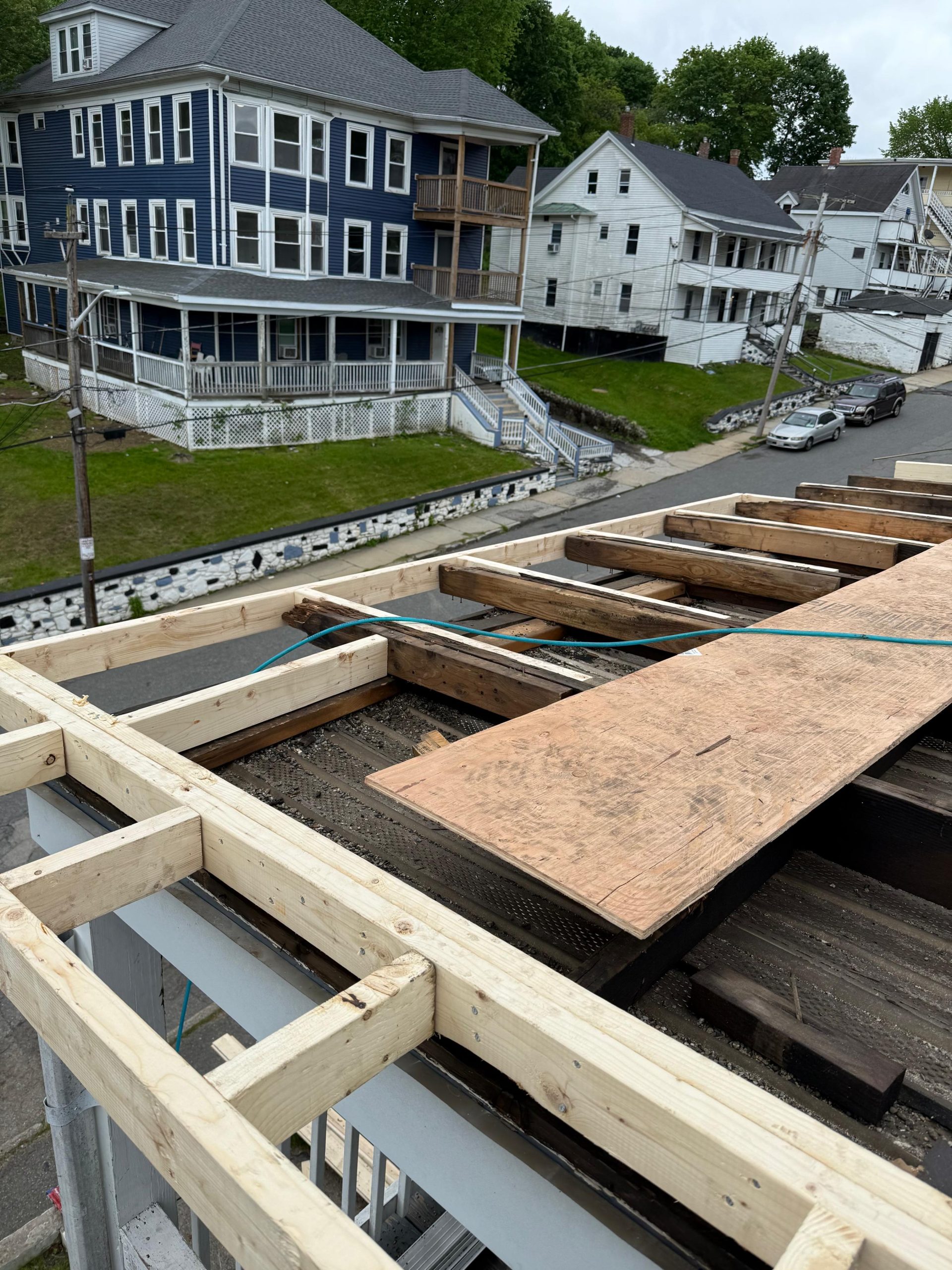 reframing roof to rebuild water damaged areas and prepare for new installation